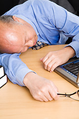 Image showing Senior asian businessman sleeping