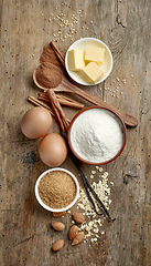 Image showing baking ingredients on wooden table