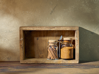 Image showing product storage jars in a wooden box