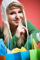 Image showing Shopping caucasian girl shushing