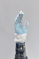 Image showing builder's hand in protective glove