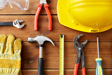 Image showing different work tools on wooden boards