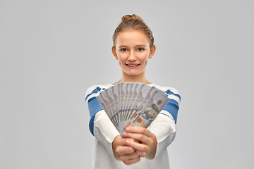 Image showing smiling teenage girl with dollar money banknotes