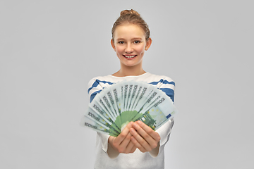 Image showing smiling teenage girl with euro money banknotes