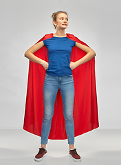 Image showing smiling teenage girl in red superhero cape