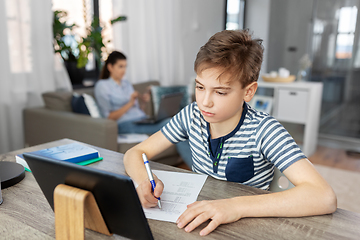 Image showing student boy with tablet computer learning at home