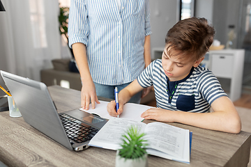 Image showing mother and son doing homework together