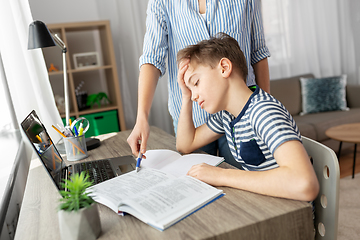 Image showing mother and son doing homework together