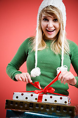 Image showing Caucasian girl opening gift