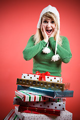 Image showing Surprised caucasian girl with gifts