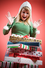 Image showing Caucasian girl receiving christmas gifts