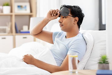 Image showing indian man lying in bed at home