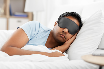 Image showing indian man in eye mask sleeping in bed at home