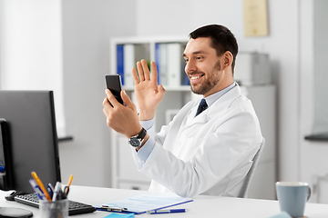 Image showing doctor with smartphone having video call at clinic