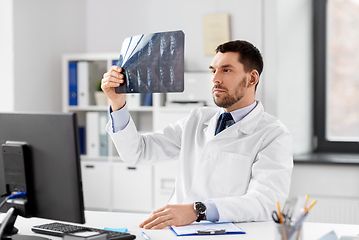 Image showing male doctor with x-ray of spine at hospital