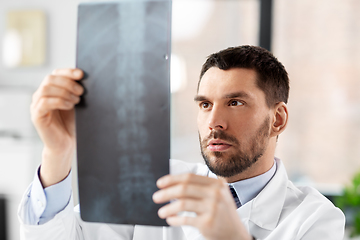 Image showing male doctor with x-ray of spine at hospital