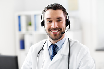 Image showing happy male doctor with headset at hospital