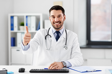 Image showing happy male doctor showing thumbs up at hospital