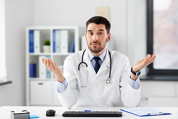 Image showing male doctor having video conference at hospital