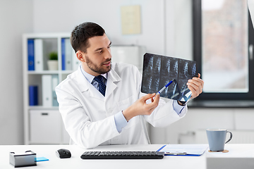 Image showing doctor with x-ray having video call at clinic