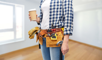 Image showing woman with takeaway coffee cup and working tools