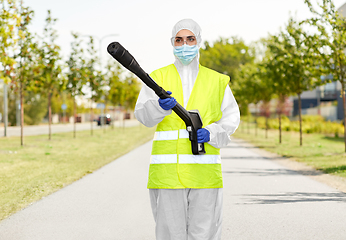 Image showing sanitation worker in hazmat with pressure washer