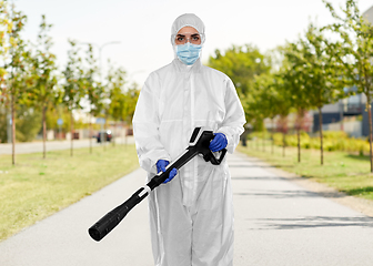 Image showing sanitation worker in hazmat with pressure washer