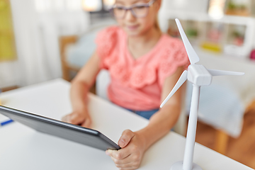 Image showing student girl with tablet pc and wind turbine