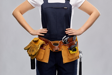 Image showing woman or builder with working tools on belt