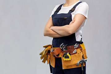 Image showing woman or builder with working tools on belt