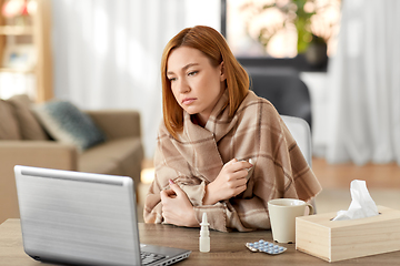 Image showing sick woman having video call on tablet pc at home