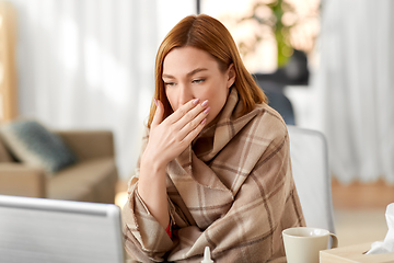 Image showing sick woman having video call on laptop at home