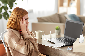 Image showing sick woman having video call on laptop at home