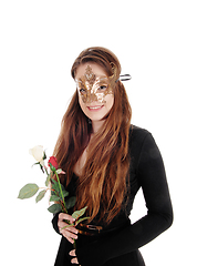 Image showing Beautiful woman with face mask and roses