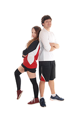 Image showing Young couple in sportswear standing back to back