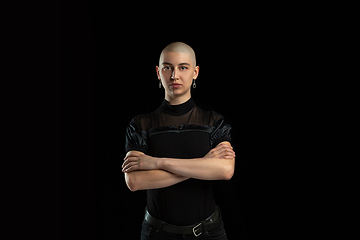 Image showing Monochrome portrait of young caucasian bald woman on black background