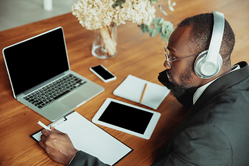 Image showing Businessman or student working from home while being isolated or keep quarantine \'cause of coronavirus COVID-19