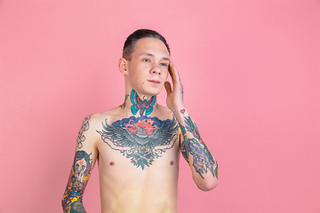 Image showing Portrait of young man with freaky appearance on pink background