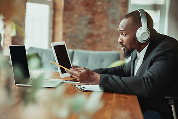 Image showing Businessman or student working from home while being isolated or keep quarantine \'cause of coronavirus COVID-19