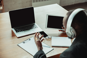 Image showing Businessman or student working from home while being isolated or keep quarantine \'cause of coronavirus COVID-19