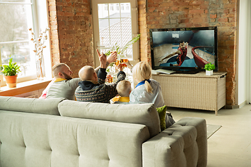 Image showing Excited family watching basketball, sport match at home