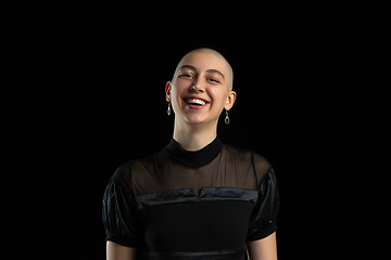 Image showing Monochrome portrait of young caucasian bald woman on black background