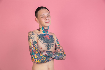 Image showing Portrait of young man with freaky appearance on pink background