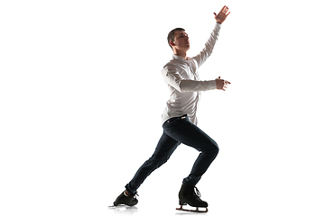 Image showing Man figure skating isolated on white studio backgound with copyspace