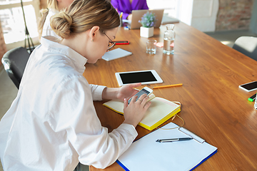 Image showing Young caucasian women working in office, diversity and girl power concept