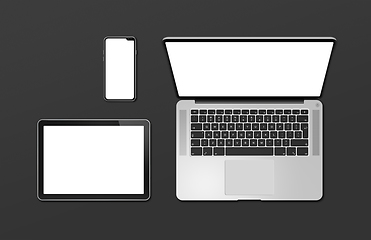 Image showing Laptop, tablet and phone set mockup isolated on black. 3D render