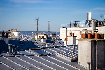 Image showing The traditional roofs of paris and the eiffel tower