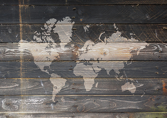 Image showing World map on a wooden wall