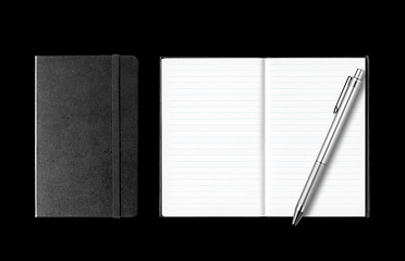 Image showing Closed and open notebooks with pen isolated on black