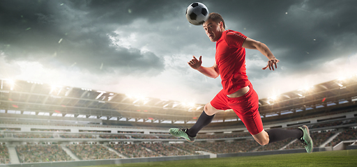 Image showing Male football or soccer player at stadium - motion, action, activity concept